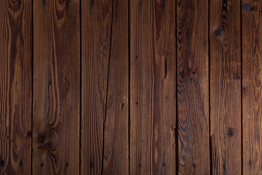 Close-up of the grain and surface of stacked treated timber boards