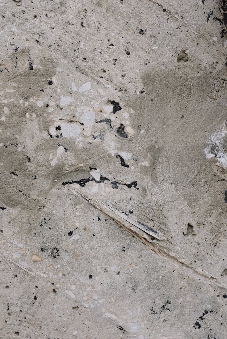 Close-up of a concrete slab surface showing texture and embedded aggregate